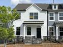 Charming two-story home with black door, fenced yard, and inviting curb appeal at 486 Traditions Grande Blvd # 28, Wake Forest, NC 27587