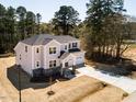 Spacious home featuring an attached two-car garage and a generous lawn at 68 Tee Time Ter, Benson, NC 27504