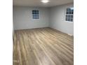 Spacious bedroom featuring wood-look tile floors, providing an elegant and modern feel at 905 Ardmore Dr, Durham, NC 27713