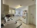 Bright kitchen with ample cabinet space, white appliances, and a functional layout for easy meal preparation at 1140 Carlton Ave # 201, Raleigh, NC 27606