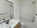 Clean bathroom with modern black fixtures and a bathtub and shower combination at 124 Horseman Dr, Louisburg, NC 27549