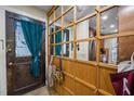 Cozy entryway featuring a mirrored coat rack and tiled floor at 130 E Longview St # Apt K, Chapel Hill, NC 27516