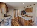 Well-equipped kitchen with a functional island, stainless steel sink, and modern finishes at 1326 Stephens Dr, Roxboro, NC 27573