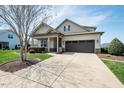 Beautiful home with a well-kept lawn and ample parking on a wide driveway at 135 Brocks Trce, Burlington, NC 27215