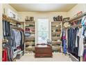 Spacious walk-in closet with organized shelving, rods, and storage for clothes and accessories at 1404 Rhea Dr, Garner, NC 27529