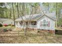 Well-maintained home with red shutters and a welcoming front porch at 1508 Middle Ridge Dr, Willow Springs, NC 27592