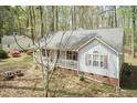 Well-maintained home with red shutters and a welcoming front porch at 1508 Middle Ridge Dr, Willow Springs, NC 27592