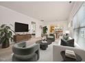 Bright living room with a modern aesthetic with neutral wall color and plenty of space at 151 Rosedale Creek Dr, Durham, NC 27703