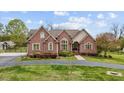Charming brick home with a well-manicured lawn and inviting front entrance at 2011 Gibsonville Ossipee Rd, Elon, NC 27244