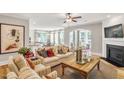 Comfortable living room with a ceiling fan, decorative furniture, fireplace, and hardwood floors at 229 Savannah Moss Way # 121, Raleigh, NC 27603