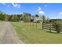 Beautiful two story home with a charming front porch, sitting on a well maintained lot with wooden fence at 2651 Bennett Rd, Creedmoor, NC 27522