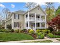 Charming two-story home with a double front porch and a meticulously landscaped front yard at 30079 Britt, Chapel Hill, NC 27514