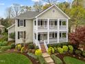 Charming two-story home with a double front porch and professionally landscaped front yard at 30079 Britt, Chapel Hill, NC 27514