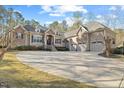 Spacious home with a large circular driveway leading to a convenient three-car garage at 36 Wellspring Cir, Clayton, NC 27527