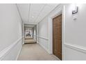 Neutral hallway with carpet and light walls, leading to elevator lobby at 510 Glenwood Ave # 602, Raleigh, NC 27603