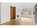 Bright living room with fireplace, large windows, and hardwood floors at 510 Glenwood Ave # 602, Raleigh, NC 27603