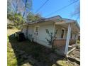View of the exterior of the home; light green siding and an outside sitting area at 529 Solar Dr Dr, Raleigh, NC 27610