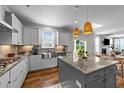 Lovely kitchen featuring granite countertops, stainless steel appliances, and natural light at 6 S Summerhill Rdg, Clayton, NC 27520