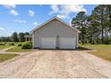 Detached two-car garage with ample parking space on a paved driveway at 664 Marler Rd, Benson, NC 27504