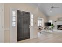 Bright entry foyer showcasing an open floor plan and sleek, light-colored flooring at 8325 Wycombe Ln, Raleigh, NC 27615