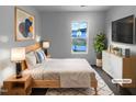 Comfortable main bedroom with a large window offering natural light and a view of the neighborhood at 932 Mailwood Dr, Knightdale, NC 27545