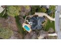 Aerial view showcases this home's pool, patio, and landscaped backyard at 111 San Juan Dr, Chapel Hill, NC 27514