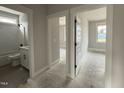 Hallway showcases the doorway to a bathroom and bedroom at 141 Ruskin Dr, Smithfield, NC 27577