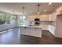Modern kitchen featuring granite countertops, stainless steel appliances, and ample cabinet space at 141 Ruskin Dr, Smithfield, NC 27577