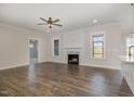 Spacious living room with hardwood floors, fireplace, and plenty of natural light at 198 Ruskin Dr, Smithfield, NC 27577