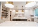 Modern kitchen with a large island, stainless steel appliances, and custom cabinetry at 2200 Paddstowe Main Way, Wake Forest, NC 27587