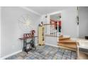 Inviting foyer featuring tile flooring, decorative accents, and a view into the adjacent living space at 2319 Somers Ave, Burlington, NC 27215
