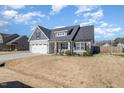 Well-kept single Gathering home showcasing its siding, roof, lawn, and curb appeal at 241 N Nolan Park Dr, Selma, NC 27576