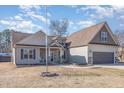Charming two-story home featuring a two-car garage, landscaped yard and inviting front porch at 2440 Us 70 A, Selma, NC 27576