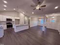 Open kitchen with stainless steel appliances, granite countertops, and a large island at 32 Tanseyleaf Dr, Smithfield, NC 27577