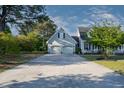 Long driveway leading to a well-maintained two-car garage with an additional entrance at 35 Fairway Ct, Dunn, NC 28334