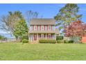 Charming two-story home featuring blue siding, red shutters and a cozy front porch at 3808 Johnson Pond Rd, Apex, NC 27539