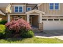 Charming two-story home with a manicured lawn and a stone-accented facade at 4121 Enfield Ridge Dr, Cary, NC 27519