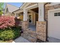Inviting front porch with stone pillars and steps, perfect for relaxing at 4121 Enfield Ridge Dr, Cary, NC 27519
