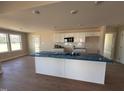 Bright kitchen boasts a large island, lots of countertop space, and modern appliances at 47 Silver Ct, Smithfield, NC 27577