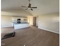 A spacious and bright living room open to kitchen with modern flooring at 47 Silver Ct, Smithfield, NC 27577