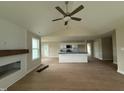 Bright living room with hardwood floors and open floor plan connects to kitchen at 47 Silver Ct, Smithfield, NC 27577