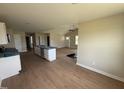 Bright open living space featuring wood floor, vaulted ceiling and view to front entry at 47 Silver Ct, Smithfield, NC 27577