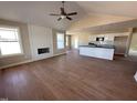 Spacious living room featuring hard wood flooring and a fireplace, perfect for relaxation at 47 Silver Ct, Smithfield, NC 27577