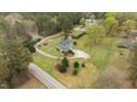 Expansive aerial view of a charming home nestled on a spacious, wooded lot at 4810 Mitchell Mill Rd, Wake Forest, NC 27587