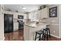 Well-lit kitchen featuring granite countertops, stainless steel appliances, and modern finishes at 4810 Mitchell Mill Rd, Wake Forest, NC 27587