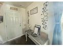 Inviting foyer featuring decor and sleek wood flooring, providing a warm welcome to this charming home at 50 Teal Dr, Youngsville, NC 27596