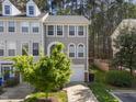 Well-maintained townhome with neutral siding, attached garage, and green lawn at 5430 Crabtree Park Ct, Raleigh, NC 27612