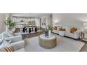Expansive living space seamlessly connects to a modern kitchen, perfect for entertaining and everyday living at 706 Fireball Ct, Knightdale, NC 27545