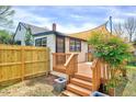 Private backyard deck, ideal for outdoor relaxation, features a new wooden fence at 829 Colleton Rd, Raleigh, NC 27610