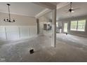 Bright open-concept living space flows into the kitchen with modern finishes at 104 Roma Gora Ct, Princeton, NC 27569